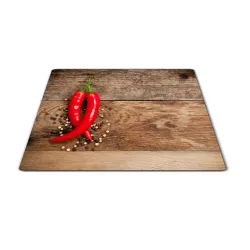 Skleněné prkénko chilli a pepř na dřevě